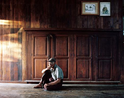 An older Shan man smokes a cigar at the Zayat Kyi Monastery on Inle Lake.