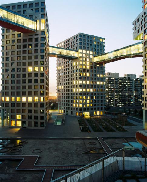 The Linked Hybrid project in Beijing, designed by Architect Steven Holl. The project is a mixed-used Residential and Retail space that focuses on green spaces and pedestrians. Heating and cooling are provided by geo-thermal wells.