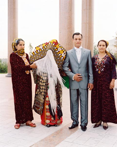 A young man and his Turkmen bride at this wedding at the Walk of Health in Ashgabat, Turkmenistan. He will not see his wife until later that evening. The Walk of Health was inaugerated by former president Saparmurat Niyazov (aka Turkmenbashi - Leader of the Turkmen People) and is a set of concrete steps set into the mountain that you can go for a nice 37km hike in 50C weather.