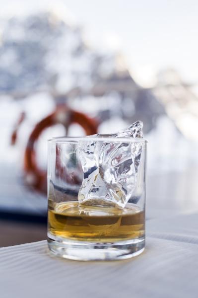 Glaciar ice - said to be ten thousand years old - reborn as an ice cube for a glass of whiskey in Antarctica. 