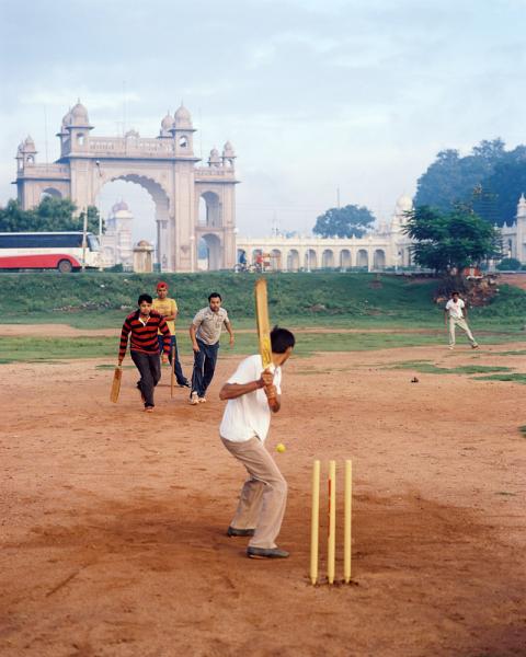 Playing some early morning cricket outside the Mysore Palace in Karnataka Province, India.