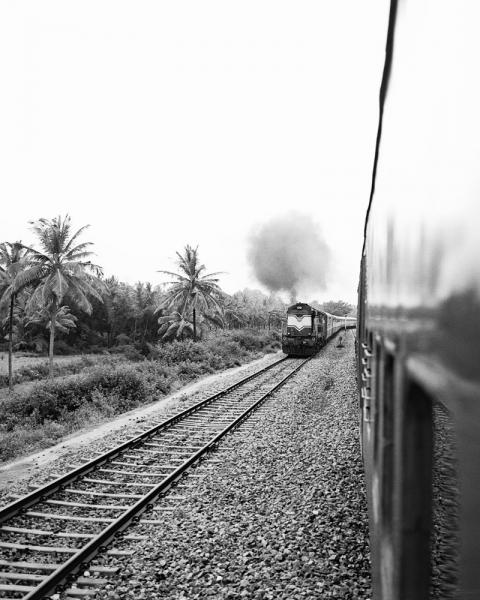 A locomotive approaching the Golden Chariot Train in Karnataka Province, India.