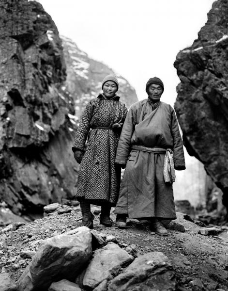 A young Mongolian couple dressed in traditional garb at an illegal gold mining camp ('Ninja Mining') in Khovsgol Province, Mongolia. Ninja Mining is the act of illegal gold mining, and the terminology is specific to Mongolia. It is a reference to the basins that the miners use to pan for gold - when slung over their backs they look like the Teenage Mutant Ninja Turtles.