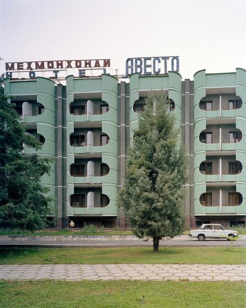 The Hotel Avesta in Dushanbe, Tajikistan complete with Russian Lada parked out front.