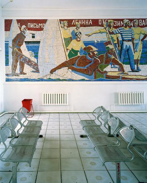 The train station in Aralsk, Kazakhstan. Note the mural depicts a scene from a bygone era with men pulling fish from the Aral Sea. The Aral Sea has all but disappeared as a result of intentional draining during the Soviet era to irrigate cotton crops in what is now Uzbekistan.
