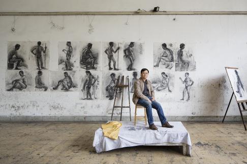 A portrait of Theson Nguyen (Nguyễn Thế Sơn) in a life-drawing studio at the Vietnam Fine Art University in Hanoi, Vietnam where he is a lecturer. Theson is an accomplished visual artist and photographer whose work has been exhibited worldwide and is held in museum and private collections (http://nguyentheson.com/).