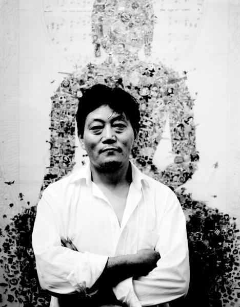 Tibetan artist Gonkar in front of one of his pieces at Red Gate Gallery at 798 in Beijing.