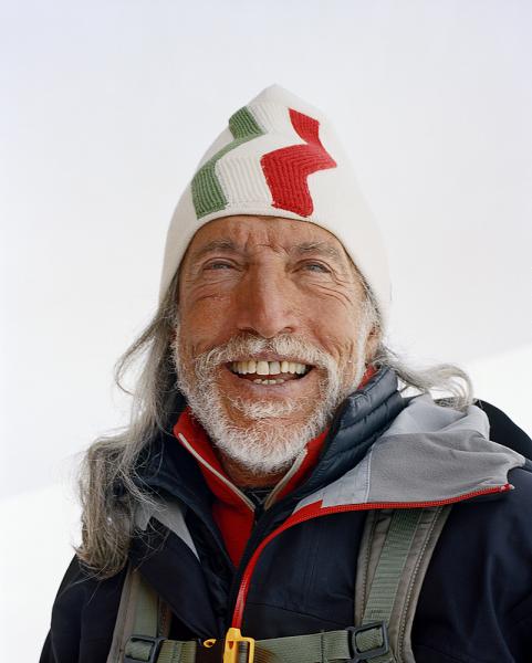 Wearing a stylized Italian flag-motif winter hat a skiier has a laugh after a pit-stop at Refugio Gran Sometta - an alpine rustic restaurant serving incredible home-style food. Tucked away high up on the mountain on the Italian side of Cervinia, near Zermatt, is The chef who started it, Luciano; who claims to be the first person to have cooked pasta on the mountain back in 1969. The dishes are all served on paper or plastic as there is no running water.