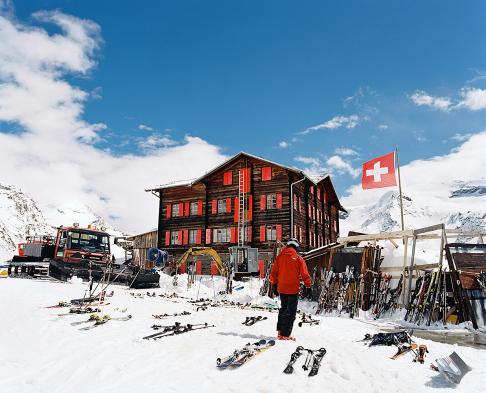 Located at 2616m, Fluhalp restaurant near Zermatt Switzlerand, has an immense outside deck for enjoying its incredible food and spectacular view of the Matterhorn on clear days. Seen here from the outside with skis lined up from the lunch crowd.